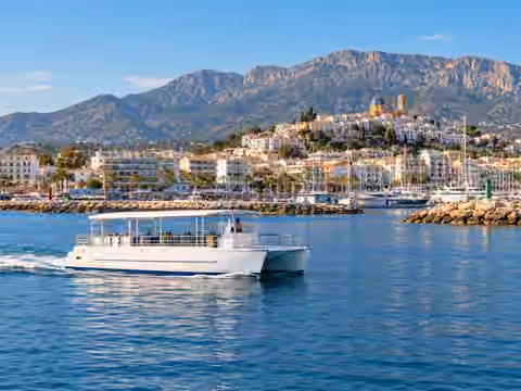Illustrative image of a boat navigating near Altea