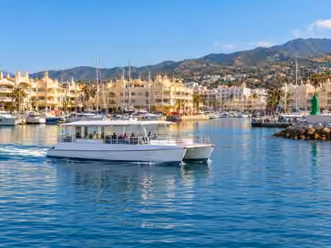 Illustrative image of a boat navigating near Benalmádena