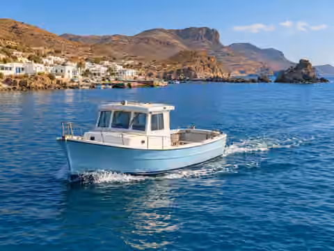 Illustrative image of a boat navigating near La Isleta del Moro · Cabo de Gata