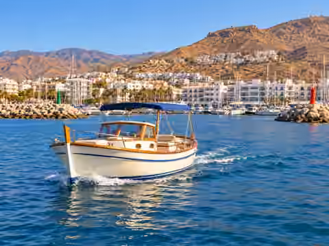 Illustrative image of a boat navigating near Roquetas de Mar
